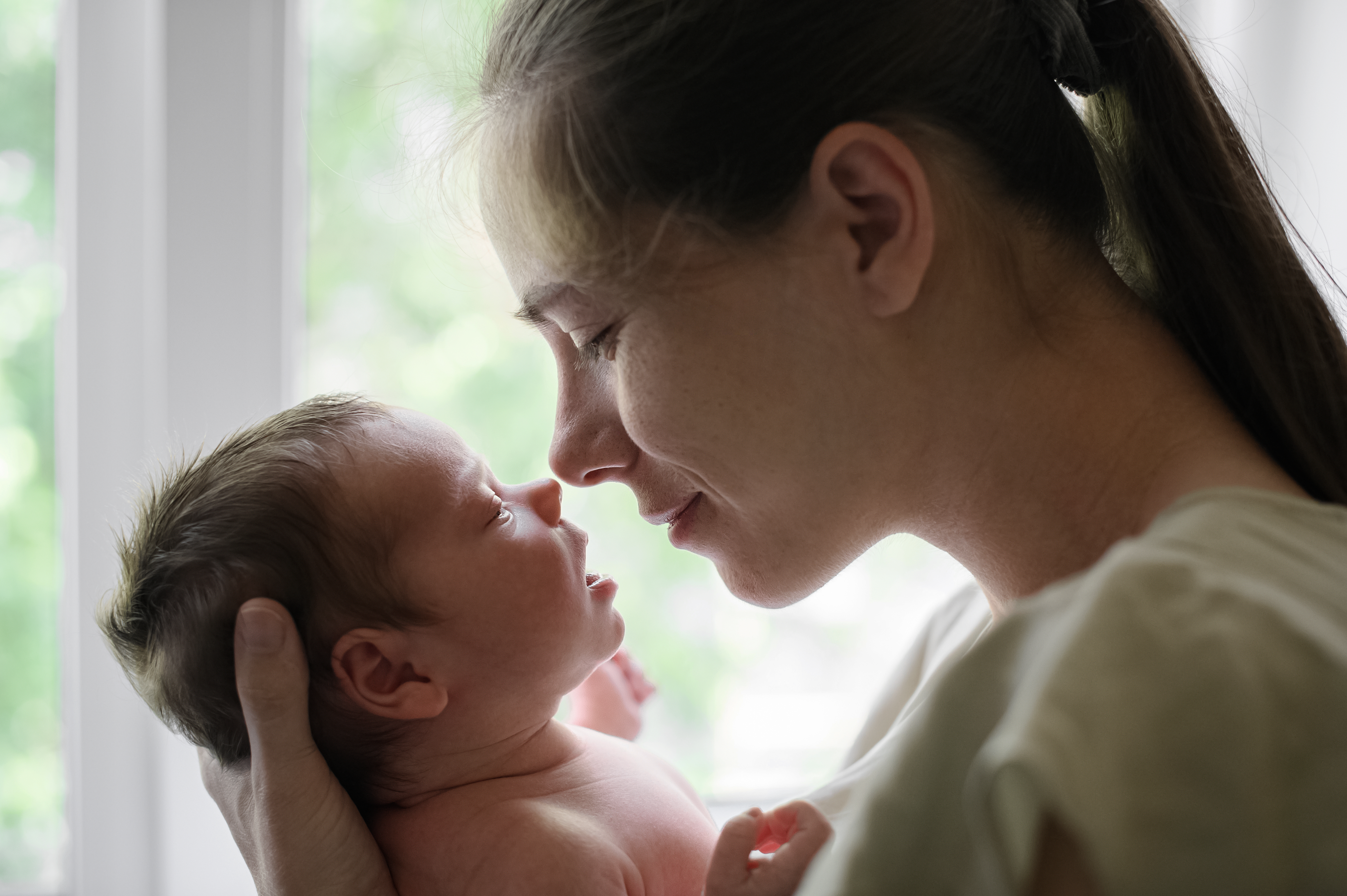 A tender moment between mother and her newborn