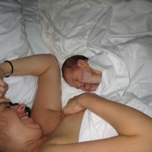 neborn baby and mother in bed